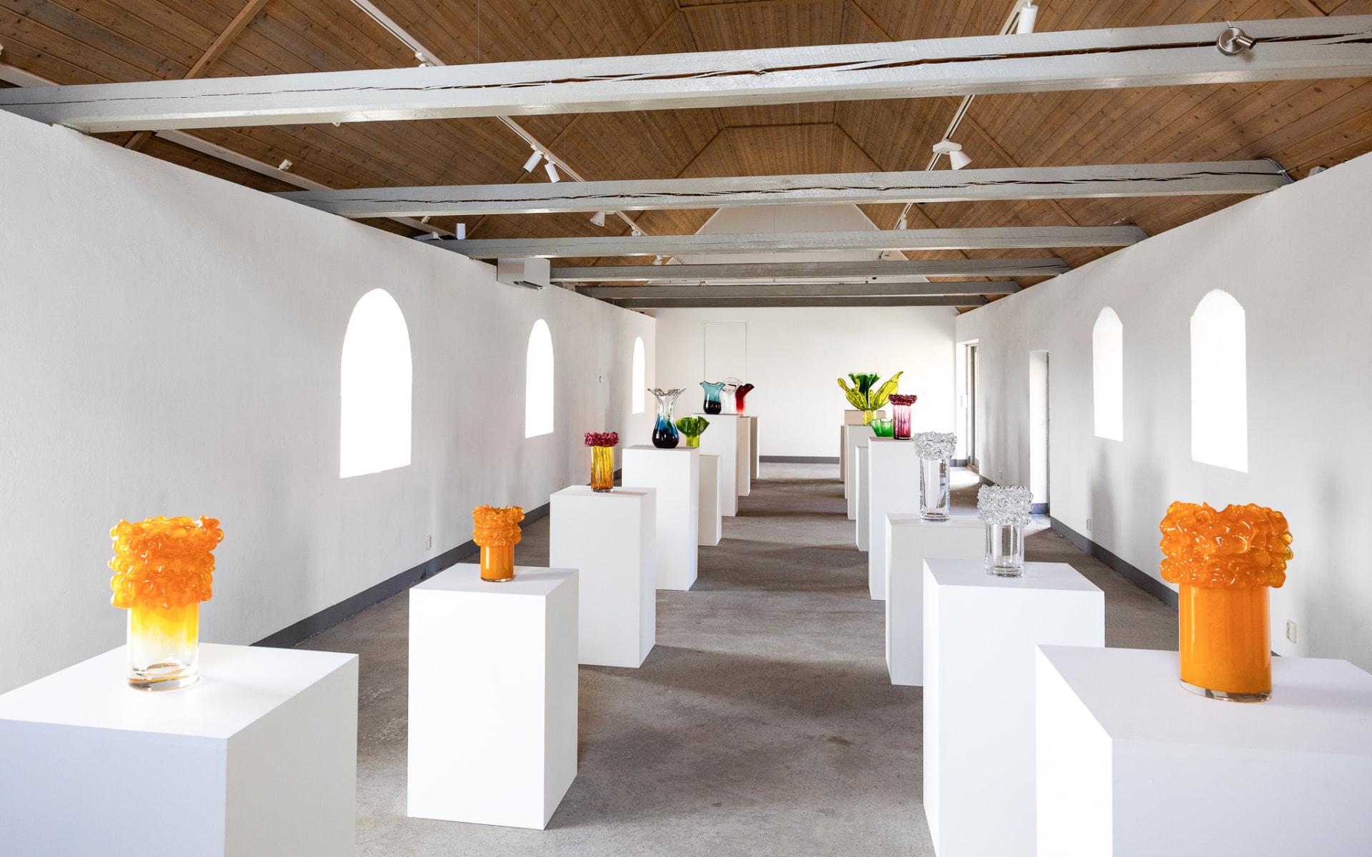 Alexander Lervik's studio set up as a gallery during Konstrundan, with glass vases on white plinths